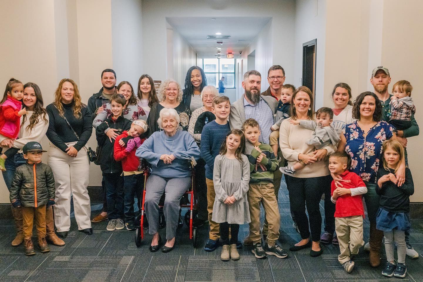 New families smiling in a courthouse